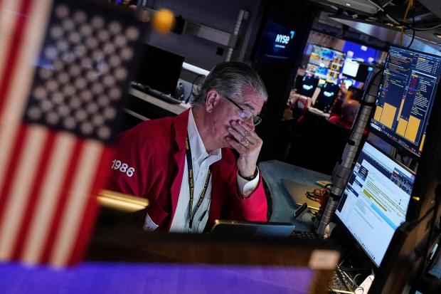 Trader Daniel Kryger works on the floor of the New York Stock Exchange