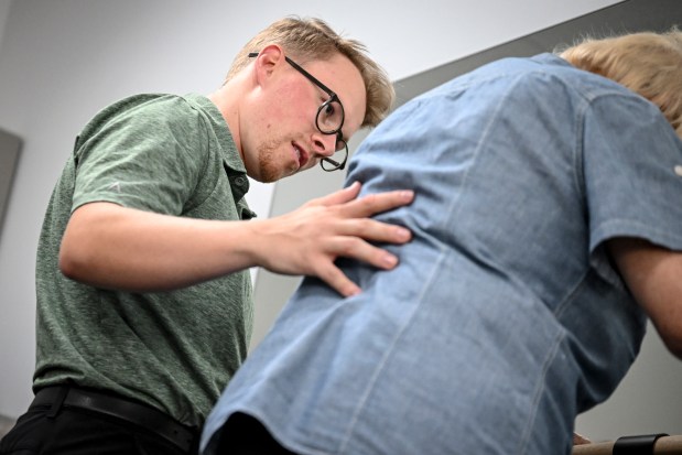 Doctor of physical therapy Jarod Maxon works with a patient at Integral Physical Therapy in Thornton, Colorado on Tuesday, July 22, 2025. (Photo by AAron Ontiveroz/The Denver Post)