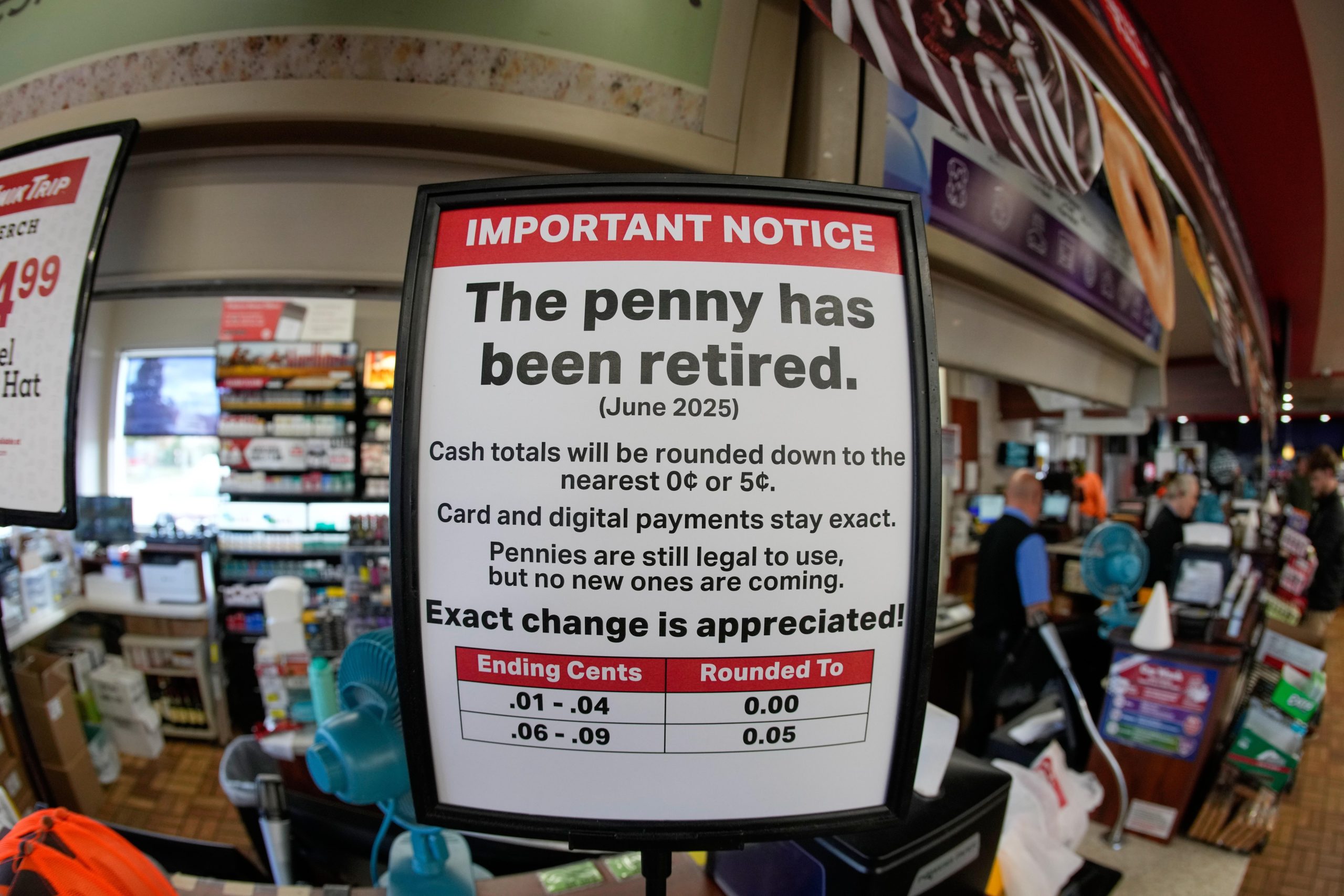 A sign in a Kwik Trip store shows the store...