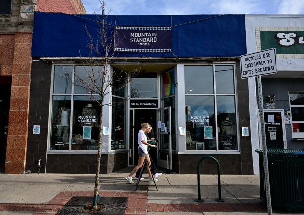 A pedestrian walks past the Mountain Standard Goods Store in Denver on Saturday, November 15, 2025. (Photo by Andy Cross/The Denver Post)